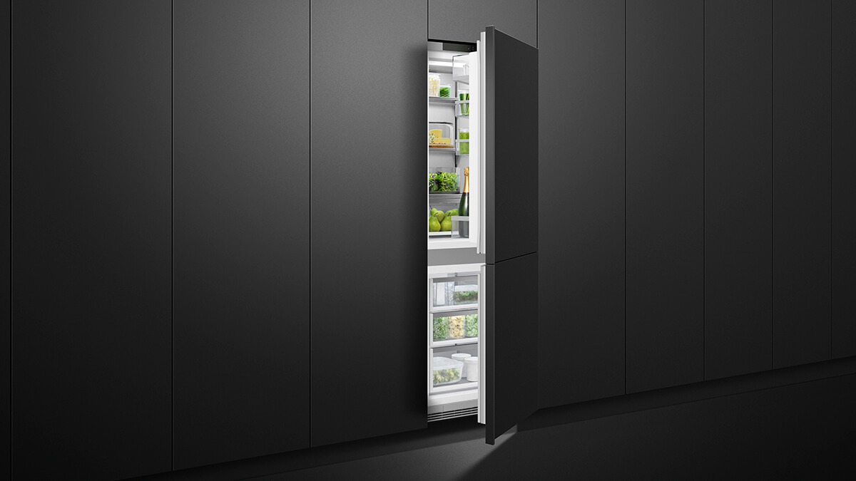 Integrated 60 centimetre bottom freezer refrigerator seamlessly installed into custom cabinetry
