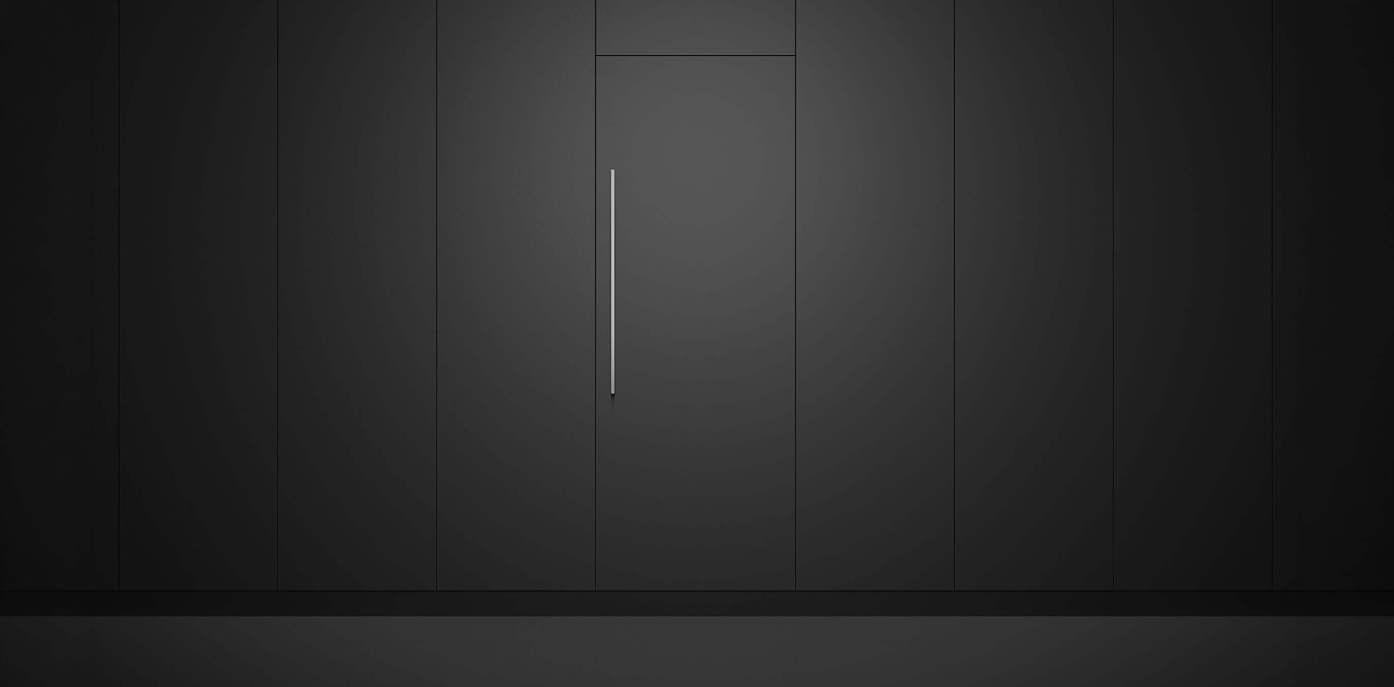 Integrated vertical refrigeration columns installed flush with custom dark cabinetry